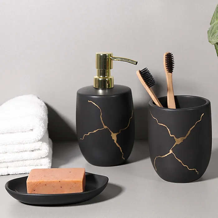 Portaspazzolino di lusso nero personalizzato tazza per collutorio Dispenser per portasapone Set di accessori per il bagno in ceramica di design in marmo dell'hotel