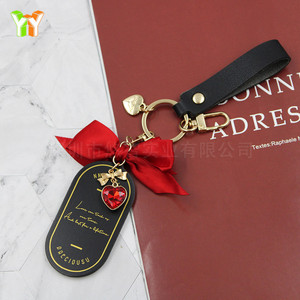 Llaveros y artículos de regalo populares para automóviles, amuletos para bolsos con forma de corazón y lazo, perfectos para el Día de San Valentín. - Product Image 1