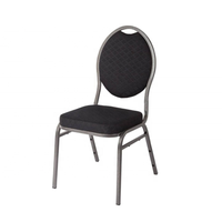 Chaise de banquet empilable en acier, dossier rond ovale, structure métallique foncée, assise rembourrée en tissu noir à pois, mobilier pour hôtels et salles.