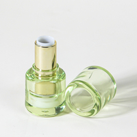 Tube de rouge à lèvres vide vert transparent rond de conception unique Mini emballage de bouteille de baume à lèvres avec applicateur