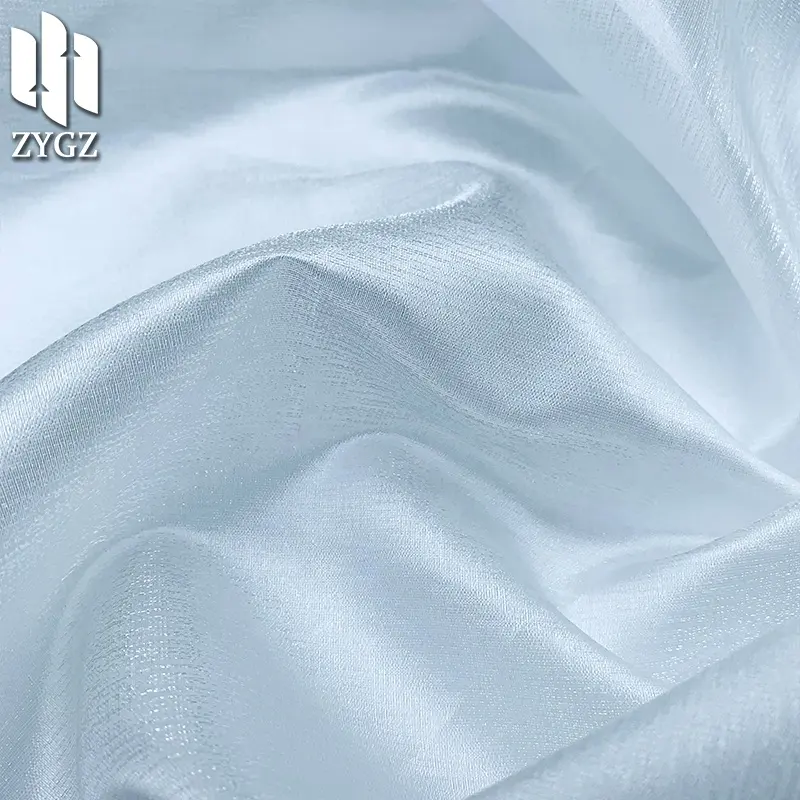 Tela de organza transpirable de poliéster brillante de seda de cristal metálico transparente de lujo para decoración de fiesta de vestido de deshierbe