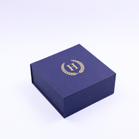 Boîte rigide en forme de livre avec fermeture magnétique bleu marine de luxe personnalisée avec du papier de soie pour l'emballage de cosmétiques haut de gamme
