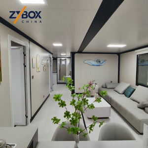 Maison conteneur extensible <span class=keywords><strong>de</strong></span> 40 pieds à toit à pignon, avec porche en treillis d'acier blanc et terrasse marron, Villa modulaire préfabriquée <span class=keywords><strong>de</strong></span> luxe AU - Product Image 2