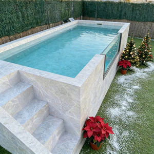 Piscine sereine avec une surface d'eau calme et un aménagement paysager minimaliste - Product Image 1