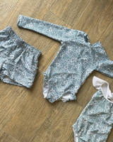 Vente en gros tissu polyester recyclé vêtements de plage personnalisés maillot de bain une pièce imprimé floral UV tropical pour bébé fille