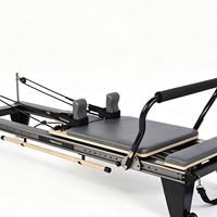 Reformer de Pilates portable et réglable noir avec cadre en alliage d'aluminium pour usage domestique et petits studios de fitness