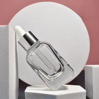 Vente en gros de flacons compte-gouttes carrés de haute qualité de la marque Doully, 10 ml à 40 ml, bouchon à vis, fond épais, verre, impression d'écran, logo personnalisé