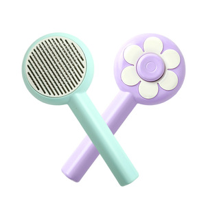 Portable one-<b>button</b> self-cleaning comb with flower design, suitable for pets, cats, and <b>dogs</b>. Features stainless steel needles - Product Image 1