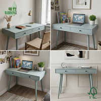 Bureau d'écriture moderne en bois écologique bleu mat avec deux tiroirs de rangement et pieds coniques pour chambre et bureau à domicile