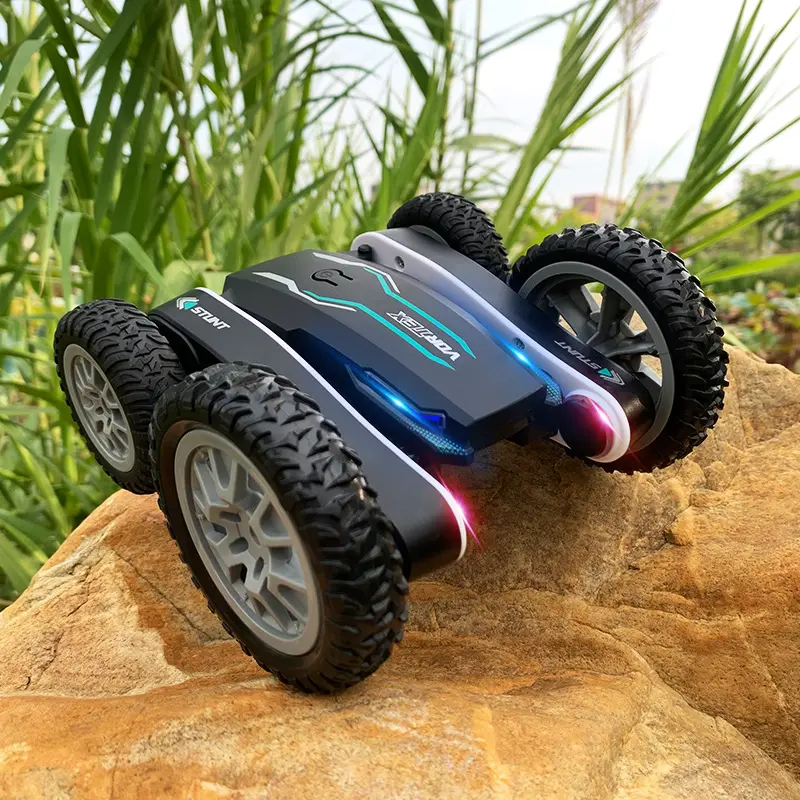 Commercio all'ingrosso della fabbrica new mountain beach road rc car con illuminazione kids electric rc twist fancy stunt rolling remote car toy