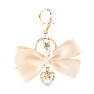 Porte-clés <span class=keywords><strong>de</strong></span> luxe fait main en forme <span class=keywords><strong>de</strong></span> nœud <span class=keywords><strong>de</strong></span> cheerleading, pendentif mignon en perles <span class=keywords><strong>et</strong></span> cœur pour sac à main, breloque en métal - Product Image 1