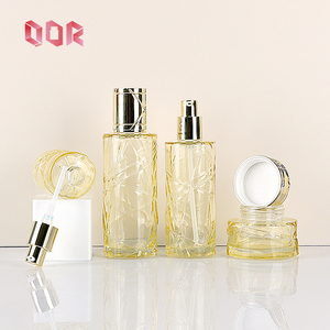 Skin Care Bottle Yellow Transparent Glass <b>Round</b> Bottle Customized Cosmetics Container Empty with Pressing Pump <b>Head</b> <b>Screw</b> Cap - Product Image 1