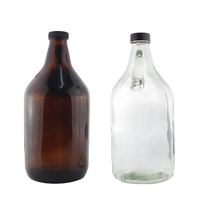 Vente directe d'usine, bouteilles en verre ambré transparentes personnalisées de 1000 ml (32 oz) pour l'emballage en verre