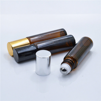 Flacon roll-on cosmétique en verre ambré bleu non transparent de 15 ml, avec bille métallique dorée estampée et sérigraphiée, diffuseur rectangulaire