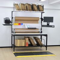 Table d'emballage robuste en acier, hauteur réglable, plan de travail avec convoyeur à rouleaux, capacité de 500 kg, certifiée ISO 9001