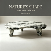 Table basse moderne artistique en marbre noir et blanc en forme de rein, idéale pour la décoration de salon de luxe.