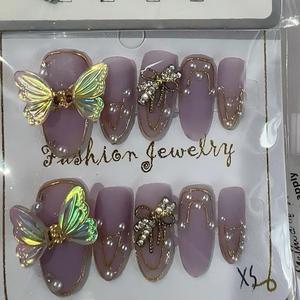 Faux ongles à presser, motifs aléatoires, 10 pièces/ensemble, haute qualité, uniques pour les fêtes - Product Image 1
