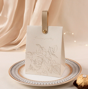 New cream-white <b>wedding</b> candy <b>box</b> with a retro French-style hand-held champagne-colored bow texture candy <b>box</b> design - Product Image 6