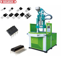 Machine de moulage par injection verticale à table rotative pour l'insertion de composants électroniques (transistors et puces)