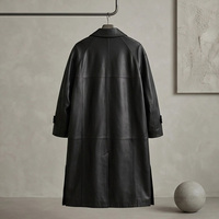 Manteau long trench-coat noir mat en cuir de vache véritable pour femme, à revers crantés, simple boutonnage, poignets ajustables, fente arrière, coupe ample