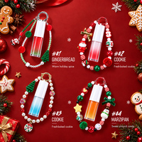 Porte-clés de Noël bicolore OEM, Huile à lèvres, Bracelet perlé, Breloque de fête, Hydratant à l'huile de Jojoba, Glisse douce, Repulpeur de lèvres personnalisé