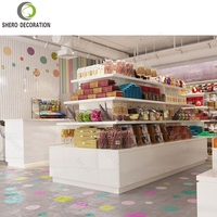 Meubles de comptoir de confiserie colorés et personnalisés, étagères, table de présentation, décoration de boutique de chocolat