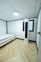 Maison conteneur pliable blanche de 40 pieds à double aile, isolée, étanche, préfabriquée, pour dortoir, à déploiement rapide pour chantier