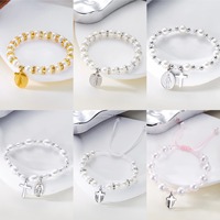 Bijoux de mode européens et américains New Madonna Cross Imitation Pearl Bracelet Fashion Commuting Elegant Joker Beaded Jewelry