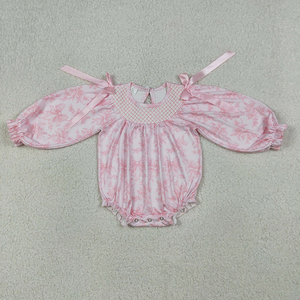 Ropa de Bebé de Moda al por Mayor: Romper Smocked Rosa con Flores y Lazos para Niñas, de Algodón Orgánico Suave - Colección Stock Trendyism Boutique - Product Image 2