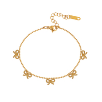 Bracelet minimaliste en acier inoxydable 304 plaqué or avec chaîne à billes fine et cinq pendentifs nœuds délicats résistants