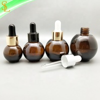 Flacons compte-gouttes en verre ambré uniques 10ml 20ml 30ml 50ml bouchons compte-gouttes en caoutchouc en forme de boule pour la sérigraphie d'huiles essentielles