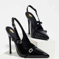 Sepatu hak tinggi model slingback warna hitam mengkilap dengan tali gesper tipis bergaya, penyangga lengkung kaki, dan penambah tinggi, cocok untuk kencan romantis di bar malam hari.