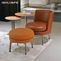 Fauteuil de détente minimaliste capitonné en cuir véritable avec repose-pieds, base rotative en acier inoxydable, finition mate, ensemble moderne pour salon