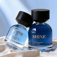Flacon de parfum élégant et transparent de qualité supérieure, 30 ml, 50 ml, 100 ml, flacon en verre vide avec pulvérisateur à pompe et impression sérigraphique, bouchon noir