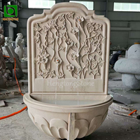 Fontaine murale en marbre naturel chinois sculptée en forme de tête de lion