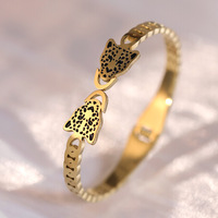 Vente de gros Bracelets haut de gamme en acier inoxydable à double tête de léopard incrustés de diamants en or 18 carats