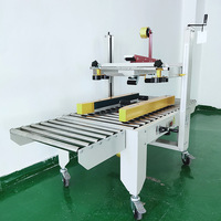 Machine de cachetage de boîte de carton à faible coût pour ligne d'emballage scellant de bande de carton efficace