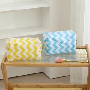 Hot Selling Ladies Fashion Custom Logo Makeup Case PVC Wavy Patter Zipper Cosmetic Bag - Product Image 1