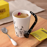 Mug à café en céramique à thème clarinette et notes musicales, style américain créatif, pour le commerce transfrontalier, stock original, mug de voyage