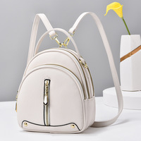 Sac à dos rond à chaîne pour femme, en cuir PU, style campus tendance, idéal pour le shopping, disponible en plusieurs couleurs