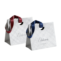 Sacs en papier cartonné cosmétique personnalisés recyclables avec logo imprimé Emballage Sacs cadeaux en papier texturé de luxe avec poignée