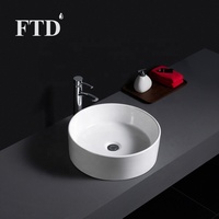 Lavabo en céramique de forme ronde moderne pour salle de bain, à poser sur le comptoir