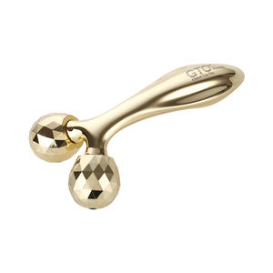 Rodillo de masaje 3D de metal Color dorado con mango largo - Product Image 1