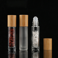 Vente en gros de flacons à bille en verre transparent givré de 10 ml pour huiles essentielles, avec couvercle en bambou