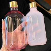 Bouteille diffuseur d'arômes en plastique PET transparent rose de 500 ml, rechargeable, avec bouchon à vis et design sérigraphié pour hydrolat