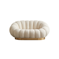 Fauteuil lounge pivotant en forme de citrouille blanc crème avec repose-pieds