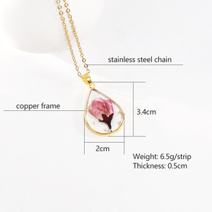 Collier <span class=keywords><strong>fleur</strong></span> du mois <span class=keywords><strong>de</strong></span> <span class=keywords><strong>naissance</strong></span> IVY 2024 avec <span class=keywords><strong>fleur</strong></span> séchée véritable en résine et chaîne en acier inoxydable pour mariages et cadeaux - Product Image 3