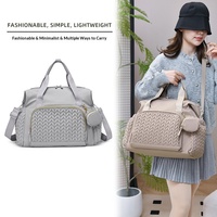 Sac à dos multifonctionnel transfrontalier pour maman et bébé, grande capacité, tendance, en tissu Oxford beige, à suspendre à la poussette