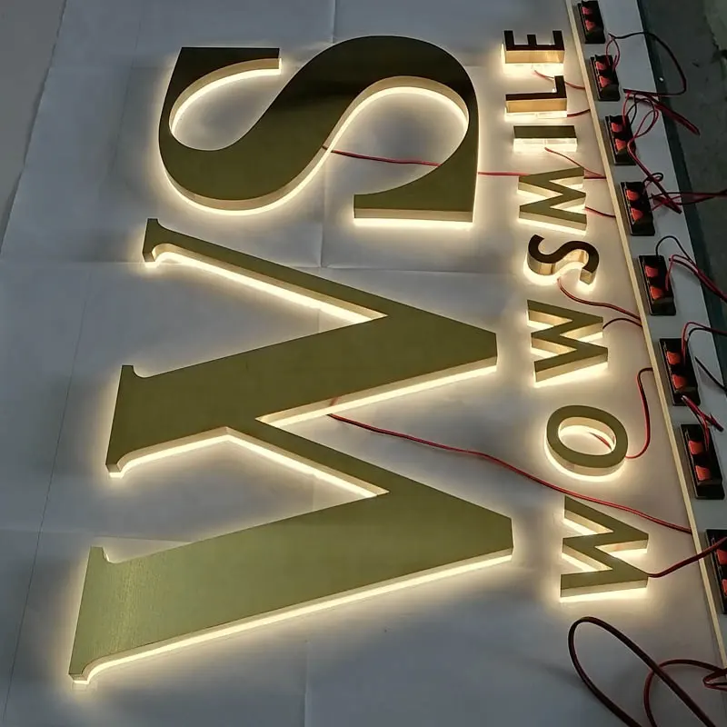 Retail sign backlit with LEDs brushed golden stainless steel face letter sign Stainless Steel Halo Lighted Backlit Letters