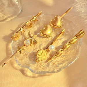กิ๊บติดผมรูปปลาดาวสองตัว เปลือกหอยสองตัว ตัวหนีบเดียว ชุบ PVD 18K สแตนเลสกันน้ำ - Product Image 1